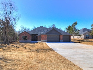 View of front of property with a front yard, a shi