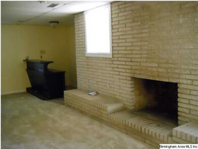 den with fireplace down stairs