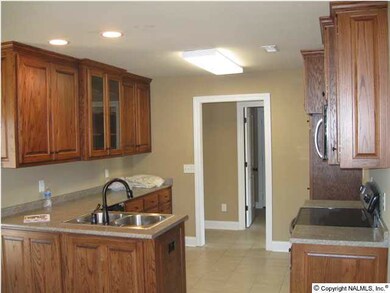 KITCHEN WITH CUSTOM CABINETS, TILE FLOOR, AND MORE!
