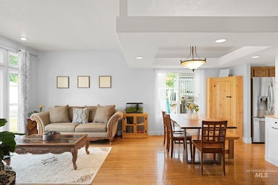 Living room featuring healthy amount of natural light, light wood-type flooring,