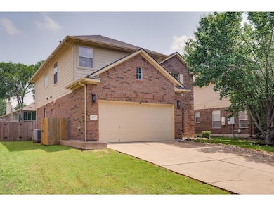 Traditional-style house featuring brick siding, c