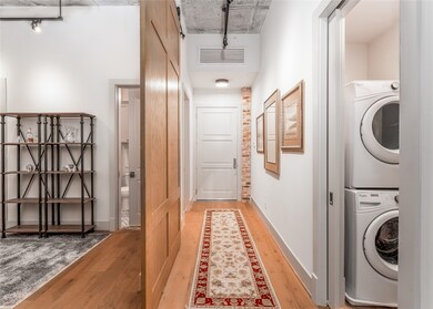 The foyer is accented by a stylish barn door to th