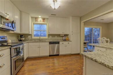 Gorgeous white cabinets provide ample storage spac