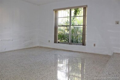 Sunken living room just off the foyer entrance.
