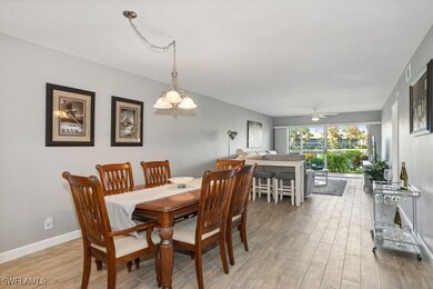 Dining area featuring notable chandelier and light
