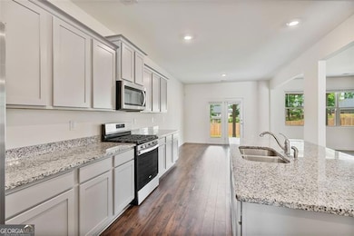 The granite counter tops are complimented with plenty of drawers and cabinetry.