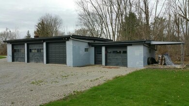 Second view of 4 1/2 car garage with three 10'x 8'