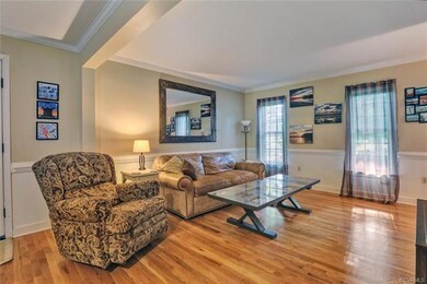 Great hardwood floor and neutral paint.