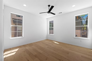 Spare room with recessed lighting, visible vents,