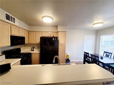 Kitchen featuring light countertops, visible vents