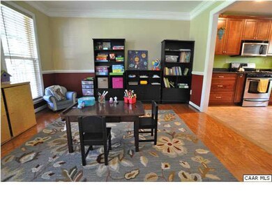 Dining room features wood flooring and open flow t
