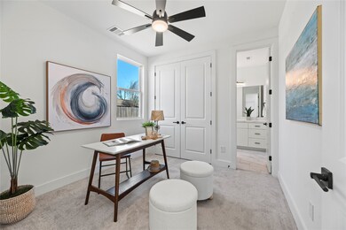 The first floor bedroom is staged as a beautiful h