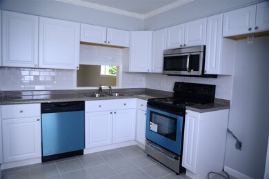 New crisp white cabinets with faux granite counter