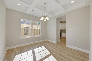 The Dining offers space for a large Dining Room table and any other furniture pieces you would like to add. You'll enjoy having access to the Kitchen with the 2 openings this area offers.