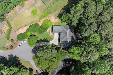 Tucked at the end of a quiet cul-de-sac, this private wooded lot offers peaceful seclusion.