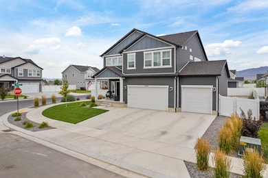 Craftsman-style house featuring board and batten siding, a residential view, concrete driveway, and a garage