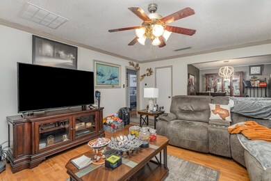 Living room featuring light hardwood / wood-style 