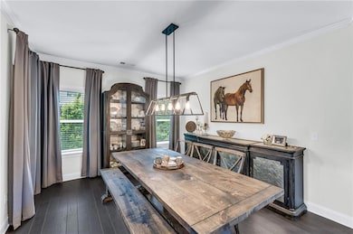 This open dining room provides seating for 12+