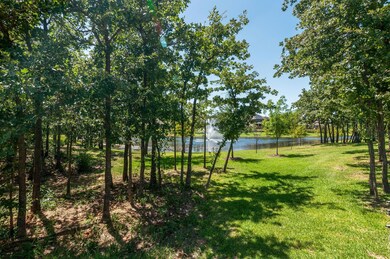 View of yard with a water view