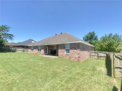 The large, fenced-in, low-maintenance back yard