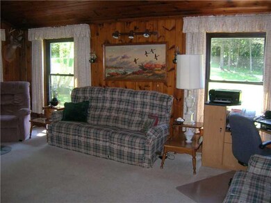 Living Room. Knotty pine walls and ceiling