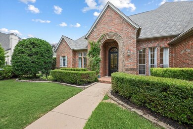 Manicured landscaping welcomes you to the covered 