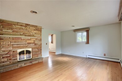 A stunning floor to ceiling stone fireplace warms the space on chilly evenings.