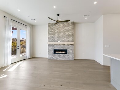 Unfurnished living room featuring a ceiling fan, 