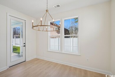 Unfurnished dining area featuring a notable chande