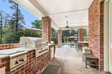 Fully Covered and Equipped Outdoor Kitchen Area.