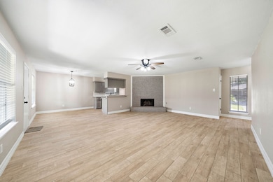 The vast living space from this corner shows how the room reaches through the breakfast nook into the kitchen.