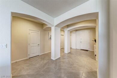 Foyer with ceramic tile floors throughout, carpet