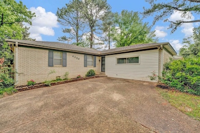 Ranch-style home with brick siding and a patio are