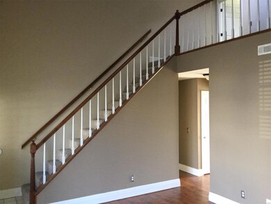 Open spindles stair case leading to loft and bedro