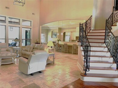 Open floor plan with beautiful staircase. Traverti