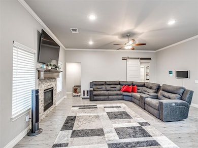 Living room with visible vents, baseboards, a ceil