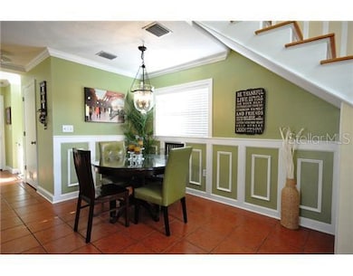 Dining Room - Modern Dining Area with Custom Moldings, check out the Red Oak Staircase!