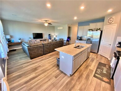 Kitchen are and Den
