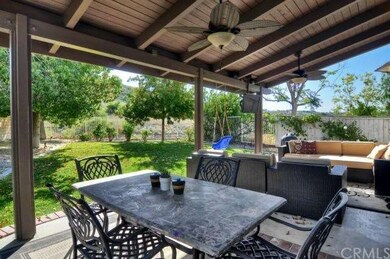 Look at this shady and comfortable patio, TV, fans