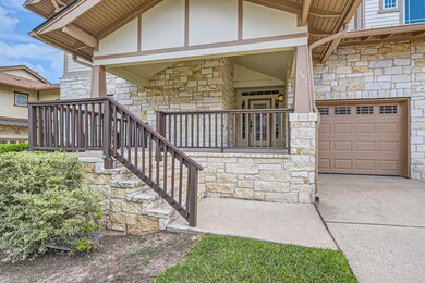View of exterior entry with covered porch, concre
