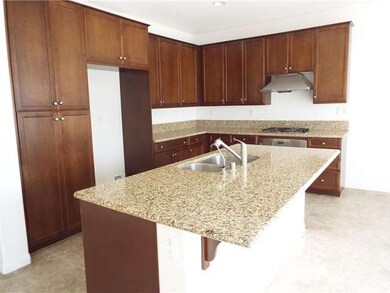 Stunning granite island kitchen. Stainless steel a