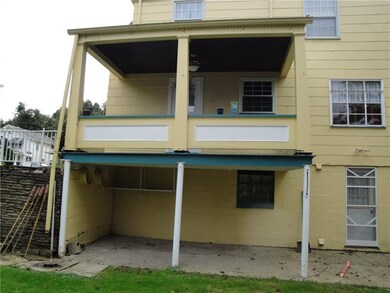 Home has a covered porch and patio...