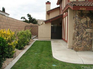 Walkway to front door. Block wall and wrought iron