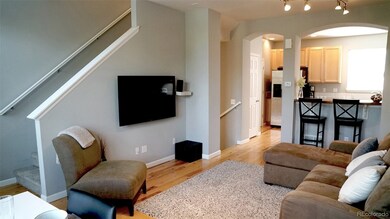 Living Room looking into kitchen, with entry from