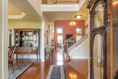 Entrance Foyer has hardwood floors and is open to dining room, family room, and study.