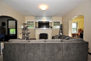 The inviting Livingroom showing the den/office to