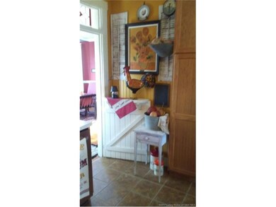 Half door with transom opens to huge eat-in kitche