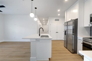 Kitchen featuring stainless steel appliances, a s