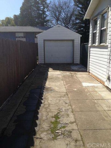 70 foot driveway with detached single garage and s