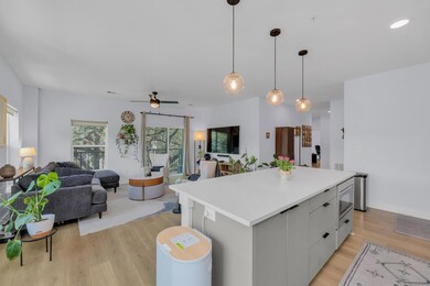 Kitchen featuring open floor plan, light wood-sty